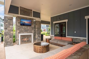 Outdoor fireplace with lounge area